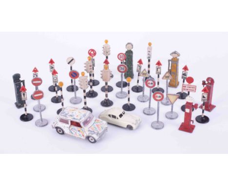 A mixed collection of lead traffic light system, petrol pump also Dinky Toys mini Minor model car and Matchbox No32 Jaguar XK