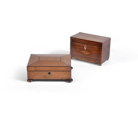 A late George III or Regency mahogany and ebony banded box, of rectangular form, strung overall, raised on four coquilla nut 