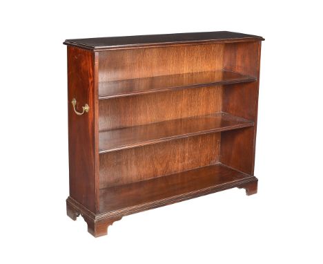 A modern reproduction mahogany open bookcase in the 18th century style, of rectangular form with three fixed shelves within b