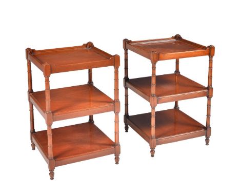 A pair of modern reproduction mahogany three tier side tables, square tiers within ring turned uprights, 40.5cms square, 65.5