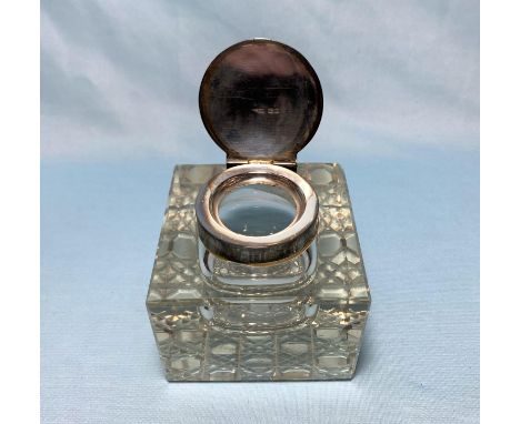 A cut glass inkwell with hinged silver lid; a silver ladle; other silver and EPNS 