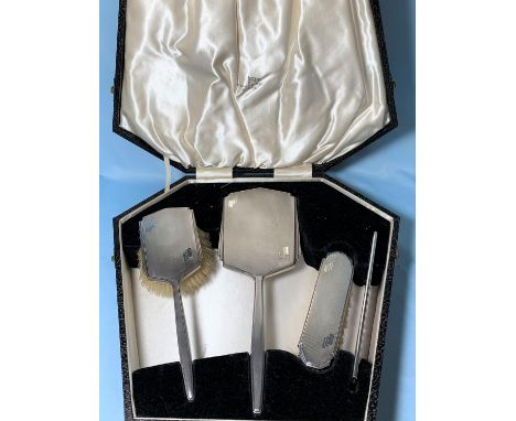 A silver Art Deco style 4 piece dressing table set, engine turned, in original box, Sheffield 1945 