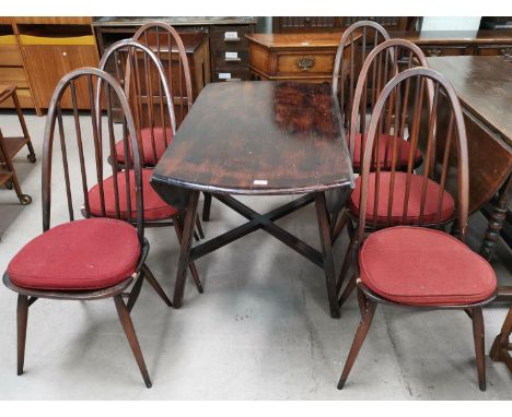 A set of 6 Ercol tall hoop and stick back chairs; an Ercol drop flap table 