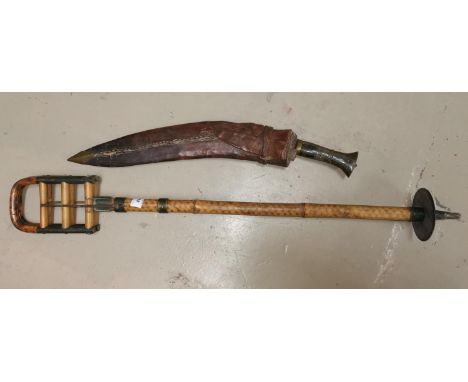 A vintage bamboo shooting stick; a kukri in leather sheath 