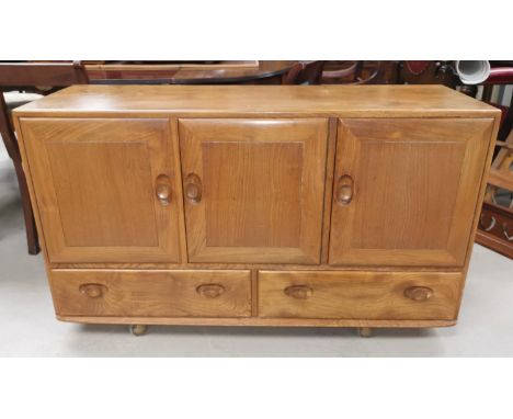 An Ercol elm and beech sideboard of 3 cupboards and 2 drawers 