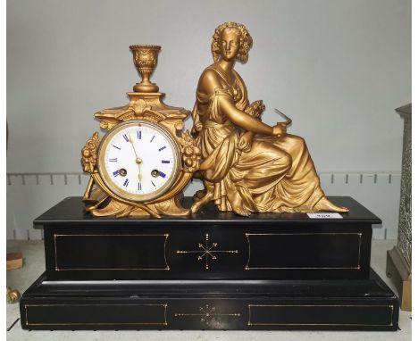 A French black slate mantel clock with spelter figure, 8 day striking movement 