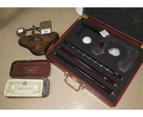 A Victorian set of postage scales; a Rolls razor; a presentation putter; etc. 