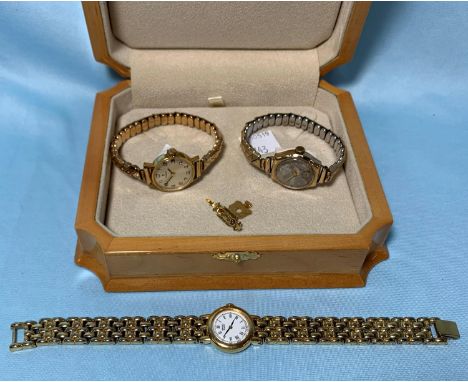A ladies vintage 9 carat hallmarked gold wristwatch on expanding plated strap; a ladies Tissot wristwatch; a ladies Seiko wat