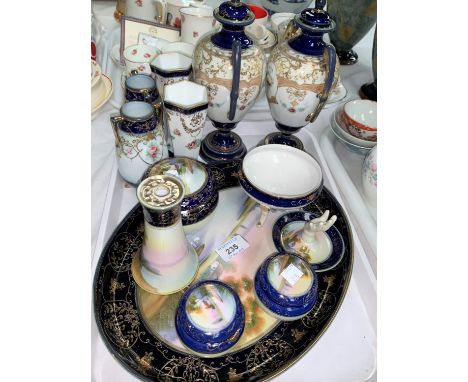 A collection of Noritake blue and gilt china with polychrome floral panels comprising 7 piece trinket set and tray; a pair of