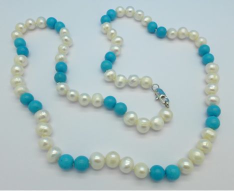 A cultured pearl and turquoise coloured bead necklace