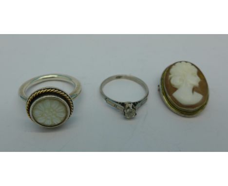 A silver Pandora daisy ring, N, a platinum set diamond ring, 2.2g, K, and a .800 silver mounted cameo brooch