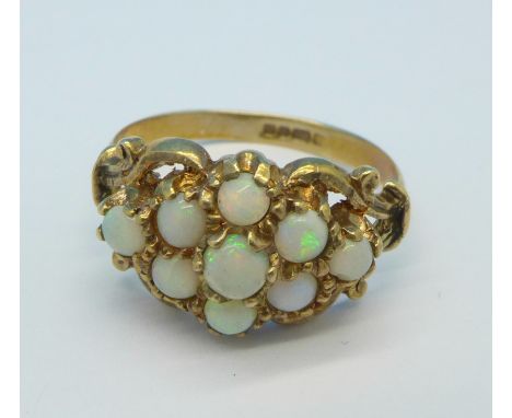 A 9ct gold and nine opal ring, 2.7g, P