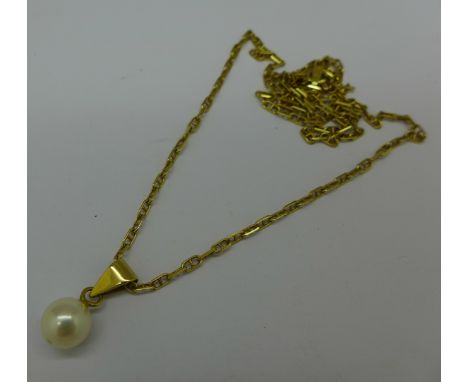 A yellow metal and pearl pendant on an 18ct gold chain, total weight 5.1g