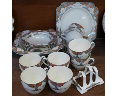 Crown Ducal Orange Tree china, six pudding bowls and dish, toast rack, a/f, eight cups and saucers and a sandwich plate