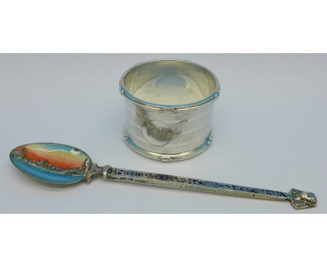 A silver napkin ring, bears initials and a white metal and enamel spoon, enamel a/f, 52g