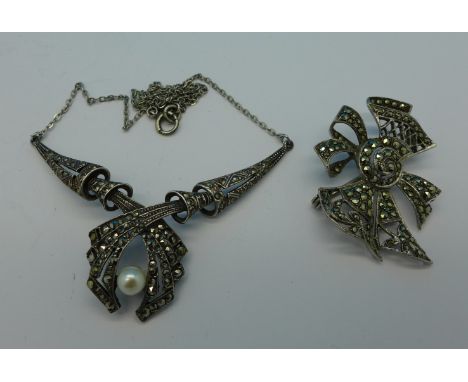 A silver marcasite and cultured pearl necklet and a silver marcasite brooch