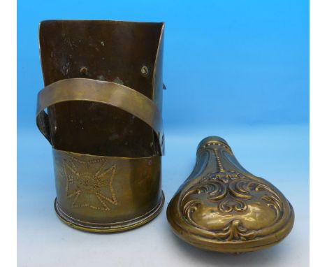 A piece of trench art with inscription and a powder flask