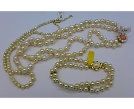 A double string cultured pearl necklace with 9ct gold clasp, a faux pearl bracelet with silver gilt clasp and one other neckl