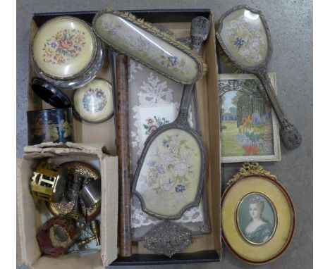 A filigree metal dressing table set including lace under glass tray, a gilt brass and ruby enamel oval portrait, enamel a/f, 