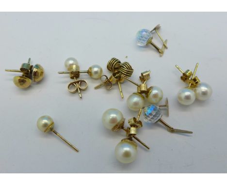 Eight pairs of 9ct gold earrings and one single gold and pearl earring
