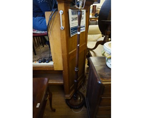 A mahogany standard lamp circa 1950s (sold electrically untested)