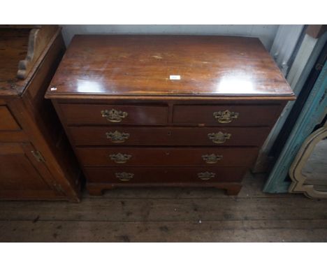 A Georgian style mahogany straight front chest of two short over three long drawers, of small proportions raised on bracket f