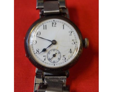 An early 20th century silver manual wind wristwatch, to an unoriginal bracelet strap  