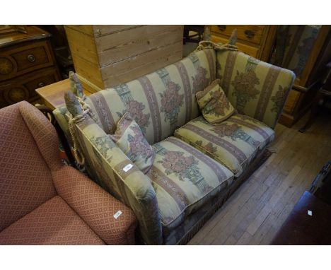 A good quality drop end sofa upholstered in a floral material.