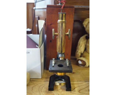 A mahogany cased W.Watson and Sons of London microscope.