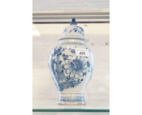 A late 18th Century Dutch ceramic baluster form jar and cover with floral decoration.