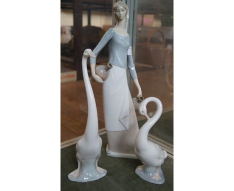 A large Lladro Nao figure of a girl together with two further Nao geese.