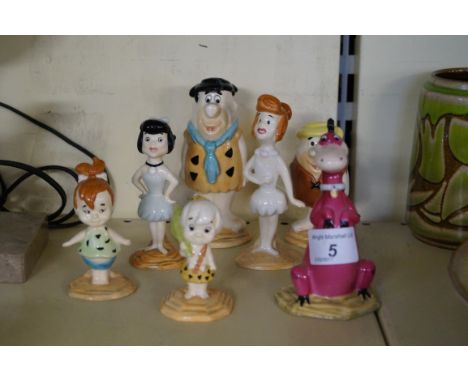 A Beswick ceramic Flintstone set, to include Fred, Wilma, Betty, Rubble, Barney, Bam Bam, Pebbles and Dino (7).   CONDITION R