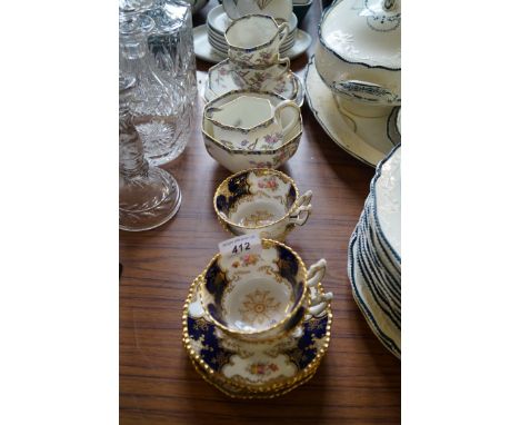 A Royal Doulton part tea service in the Spring pattern, together with four late 19th Century Coalport cups and saucers with f