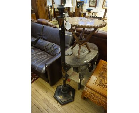 A 20th Century lacquered standard lamp having chinoiserie decoration (sold electrically untested)