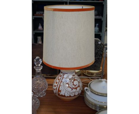 A circa 1960's Italian ceramic lamp base, of baluster form, having incised floral decoration, stamped made in Italy to base, 