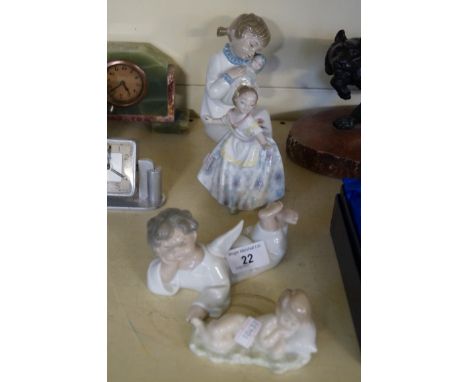 Four assorted Lladro and Nao figures to include a young dancing girl, a figure holding a doll, an angel lying down etc.