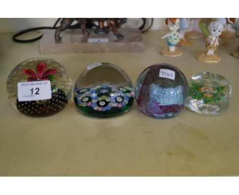Four assorted glass paperweights to include Caithness example and one possibly Perthshire.   CONDITION REPORT:  Light scratch