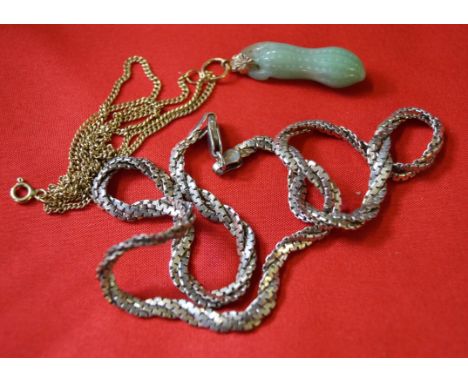 A Jadeite jade pendant and yellow metal chain, together with, a white metal silver twist chain (2)  