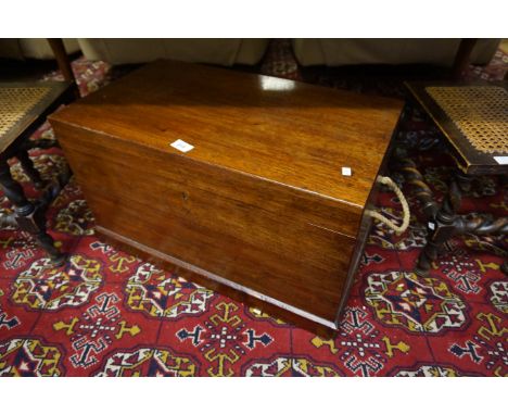 20th Century mahogany trunk with two rope handles.