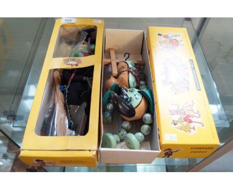 Two vintage Pelham puppets to include Baby Dragon puppet and Wicked Witch puppet.
