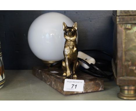 An Art Deco desk lamp modelled in a gilt spelter alastain beside milk glass shade.   CONDITION REPORT:  Good condition