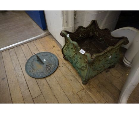 A good quality green painted garden planter together with a contemporary sun dial.