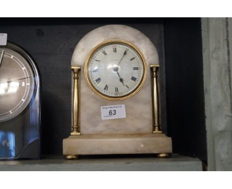 A good quality alabaster mantel clock with dial marked Vincent.