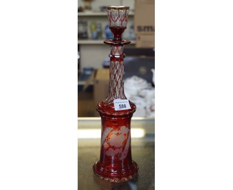 A etched ruby red glass bohemian decanter with floral decoration.