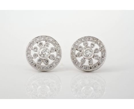 A pair of vintage style 18ct white gold and diamond floral cluster stud earrings, the floral clusters of brilliant cut diamon