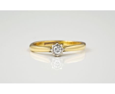 An 18ct gold and platinum single stone diamond ring, the brilliant cut diamond over chenier shoulders, ring size K½.