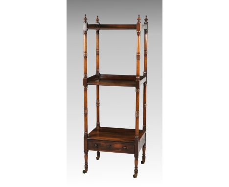 A George IV rosewood three tier whatnot, with three quarter galleried shelves and an open lower shelf with single frieze draw