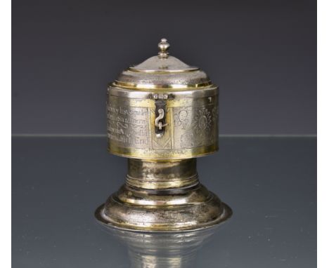 An antique silver and parcel gilt cylindrical footed Pyx, probably German, believed 17th century or earlier, stamped with 'A'