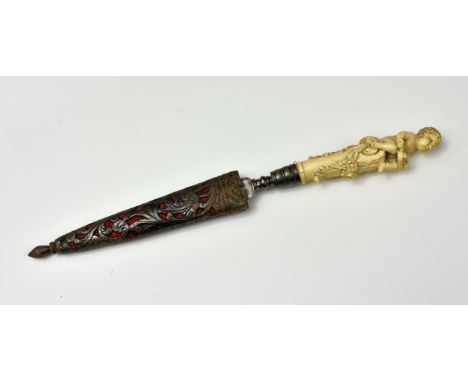 An 17th / 18th century carved ivory miniature dagger or knife, French, the handle finely carved as a cherub with hurdy gurdy 