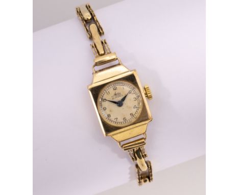 A mid-century Avia 9ct gold ladies manual wristwatch, hallmarked Chester 1950, with signed, circular silvered dial, the squar